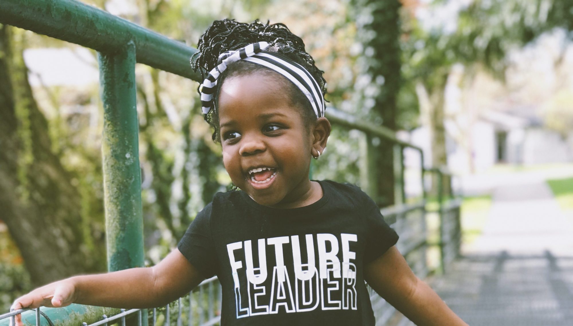 young girl wearing a t shirt with the slogan 'future leader'