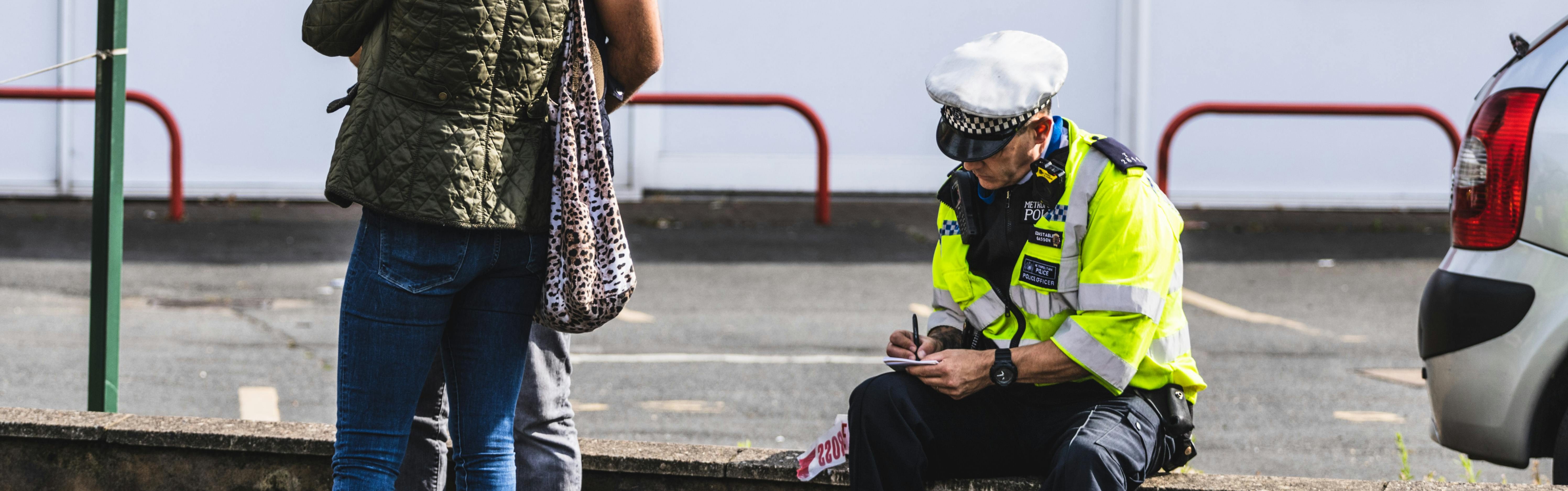 pexels-iprobets-10859265 Police Office Sitting on Wall and Writing