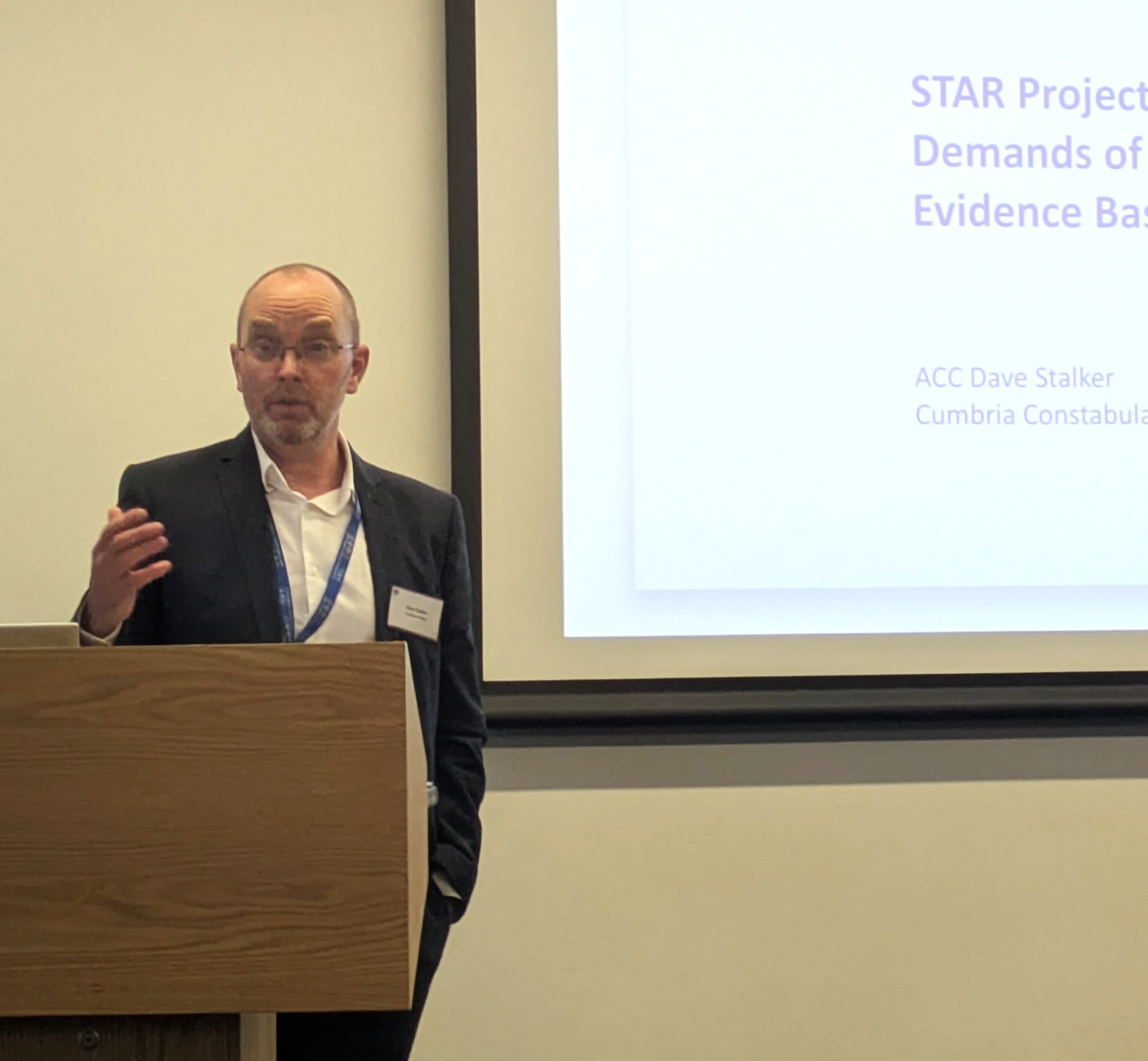 Man giving a presentation at a lectern