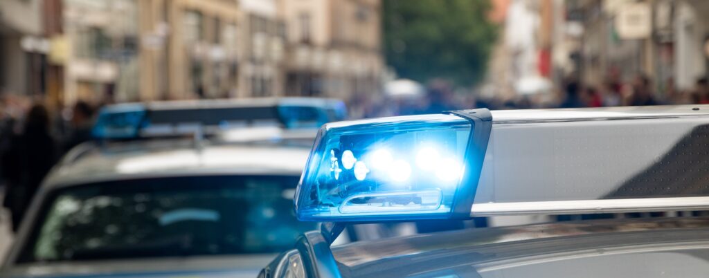 Close up of police cars with blue lights
